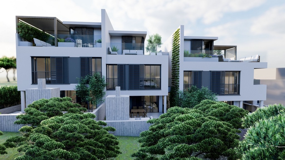 Frontansicht einer modernen Immobilie in Kroatien mit mehreren Etagen und Balkonen.